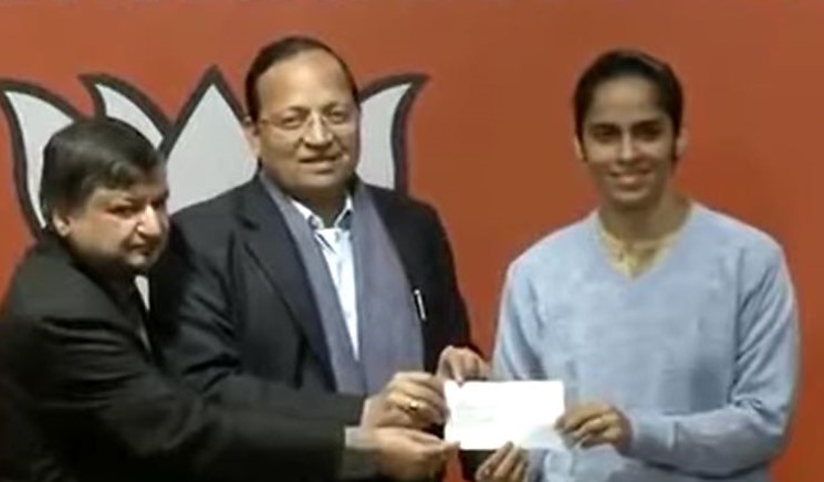 Badminton Player Saina Nehwal is seen with BJP General Secretary Arun Singh at party office in Delhi