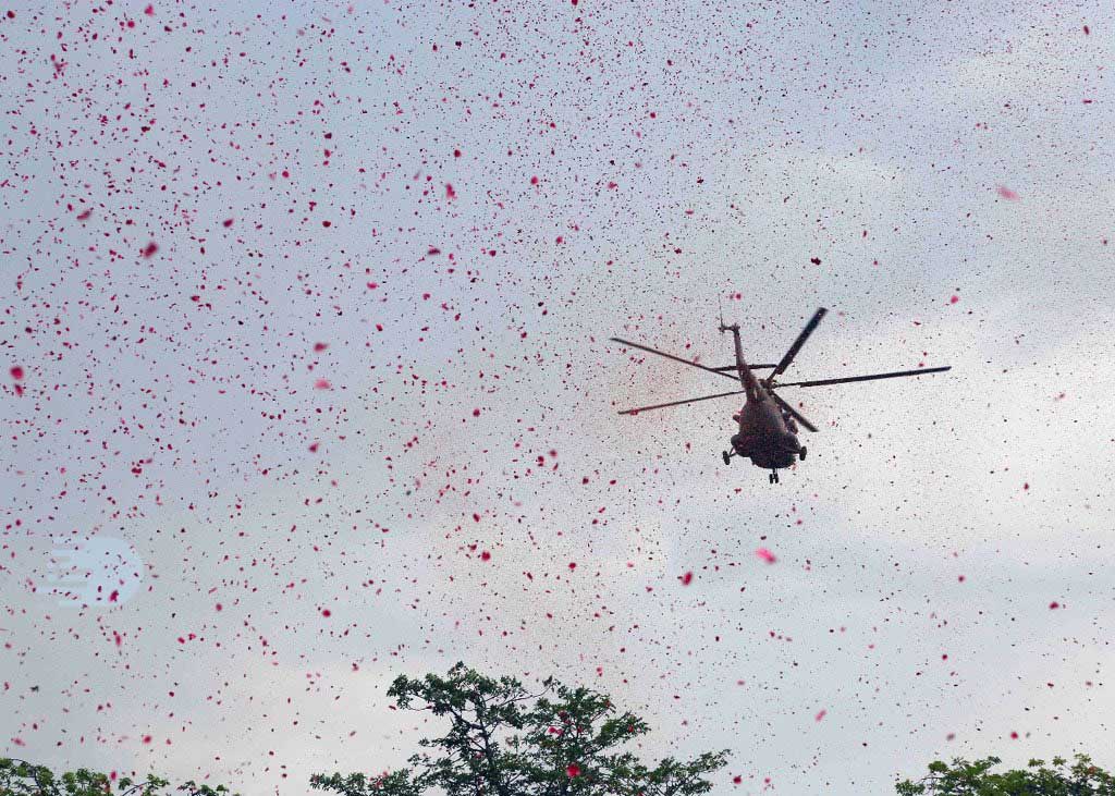 Choppers shower petals on a Hospital