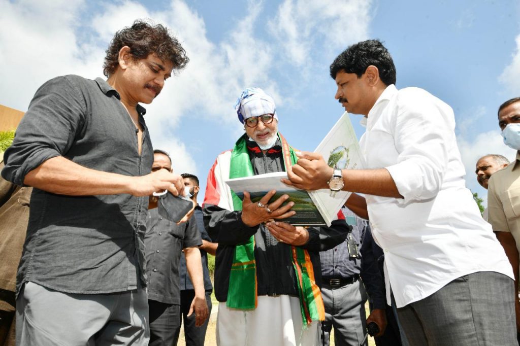 MP Santosh Kumar explaining the book Vruksha Vedam to Super Star Amitabh Bachchan, as Actor Nagarjuna also listens.