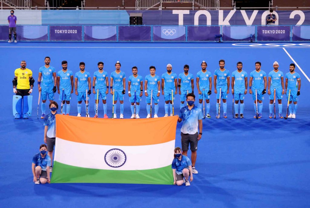 Indian Hockey team with Indian flag at Tokyo Olympics