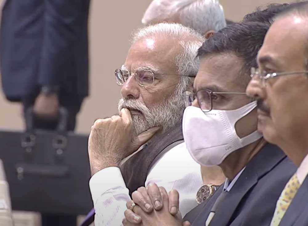 Prime Minister Modi listens to the CJI’s speech