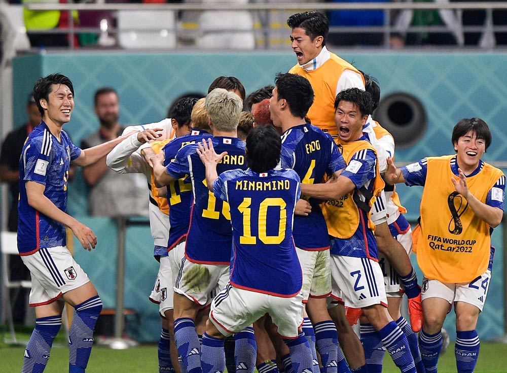Japanese-players-celebrate-after-defeating-Germany