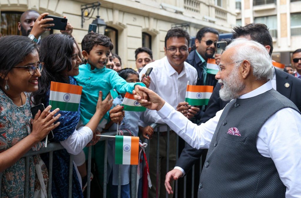 PM Modi is greeted by Indian diaspora in France