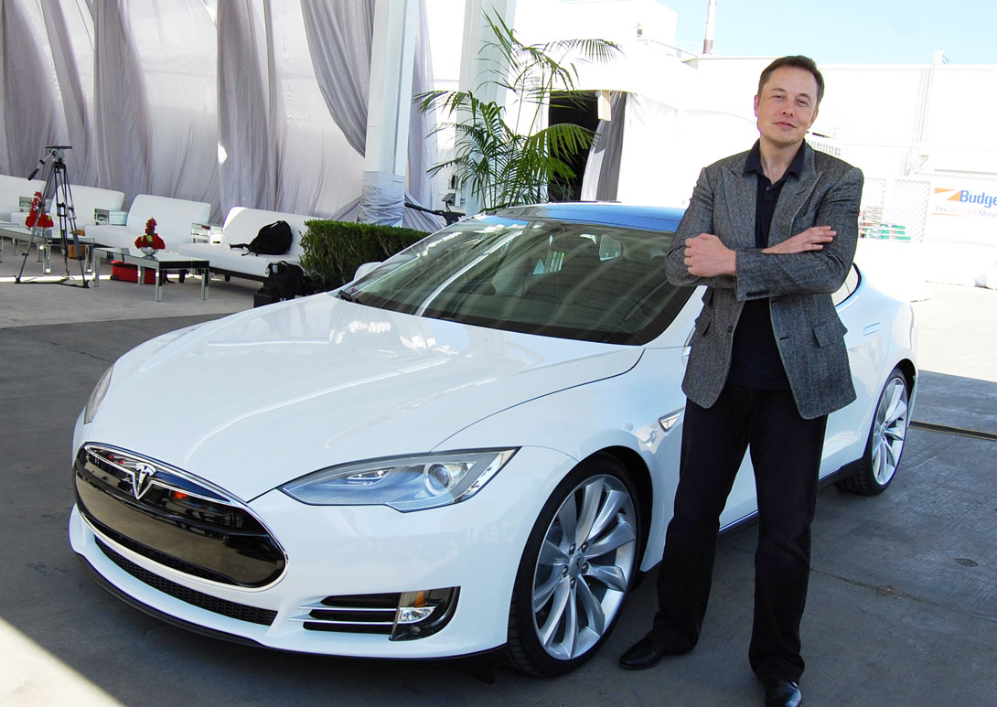 Elon-Musk-with-a-tesla-car