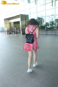 Adah Sharma in a red summer dress while traveling from Mumbai Airport