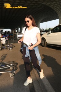 Aditi Rao Hydari in a White T-Shirt and Black Jeans at Airport