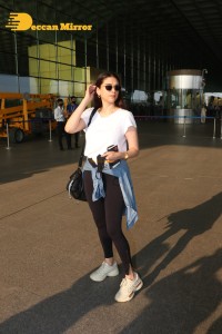 Aditi Rao Hydari in a White T-Shirt and Black Jeans at Airport