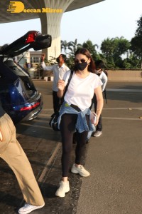Aditi Rao Hydari in a White T-Shirt and Black Jeans at Airport