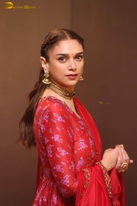 Indian actress Aditi Rao Hydari in a red lehenga choli dress