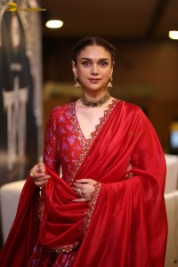 Indian actress Aditi Rao Hydari in a red lehenga choli dress