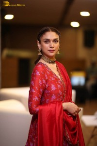 Indian actress Aditi Rao Hydari in a red lehenga choli dress