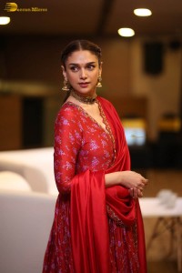 Indian actress Aditi Rao Hydari in a red lehenga choli dress