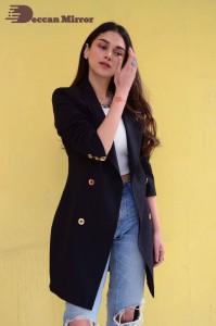 Aditi Rao pictures in white top, blue jeans and black overcoat