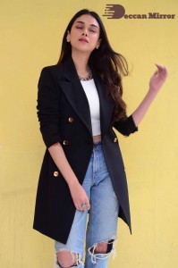 Aditi Rao pictures in white top, blue jeans and black overcoat
