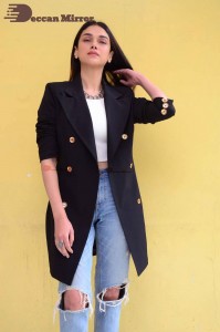 Aditi Rao pictures in white top, blue jeans and black overcoat