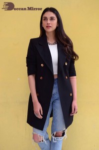 Aditi Rao pictures in white top, blue jeans and black overcoat