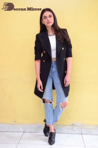 Aditi Rao pictures in white top, blue jeans and black overcoat