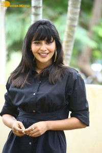 Actress Aishwarya Lekshmi photoshoot in a black dress