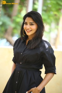 Actress Aishwarya Lekshmi photoshoot in a black dress