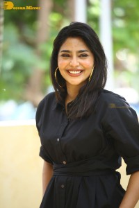 Actress Aishwarya Lekshmi photoshoot in a black dress