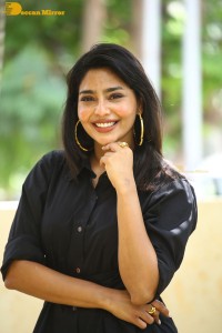 Actress Aishwarya Lekshmi photoshoot in a black dress