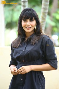 Actress Aishwarya Lekshmi photoshoot in a black dress