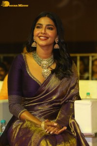 Actress Aishwarya Lekshmi in a purple saree at the pre-release event of Ponniyin Selvan