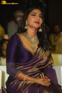 Actress Aishwarya Lekshmi in a purple saree at the pre-release event of Ponniyin Selvan