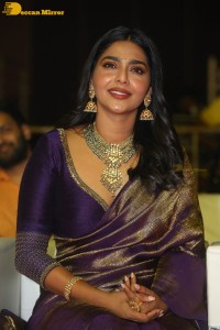Actress Aishwarya Lekshmi in a purple saree at the pre-release event of Ponniyin Selvan