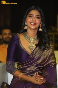 Actress Aishwarya Lekshmi in a purple saree at the pre-release event of Ponniyin Selvan