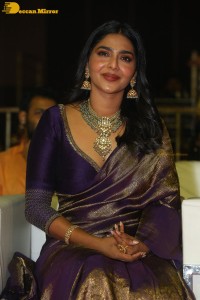 Actress Aishwarya Lekshmi in a purple saree at the pre-release event of Ponniyin Selvan