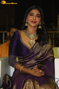 Actress Aishwarya Lekshmi in a purple saree at the pre-release event of Ponniyin Selvan