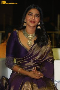 Actress Aishwarya Lekshmi in a purple saree at the pre-release event of Ponniyin Selvan