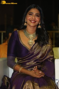 Actress Aishwarya Lekshmi in a purple saree at the pre-release event of Ponniyin Selvan