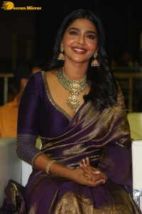 Actress Aishwarya Lekshmi in a purple saree at the pre-release event of Ponniyin Selvan