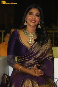 Actress Aishwarya Lekshmi in a purple saree at the pre-release event of Ponniyin Selvan