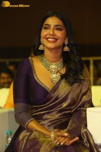 Actress Aishwarya Lekshmi in a purple saree at the pre-release event of Ponniyin Selvan