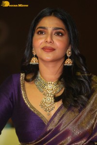 Actress Aishwarya Lekshmi in a purple saree at the pre-release event of Ponniyin Selvan