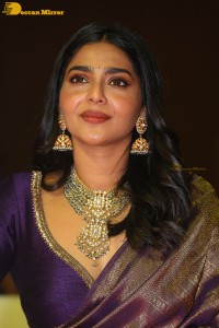 Actress Aishwarya Lekshmi in a purple saree at the pre-release event of Ponniyin Selvan