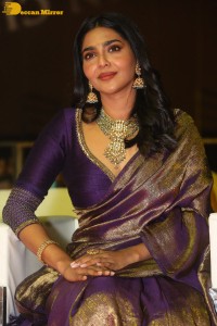 Actress Aishwarya Lekshmi in a purple saree at the pre-release event of Ponniyin Selvan