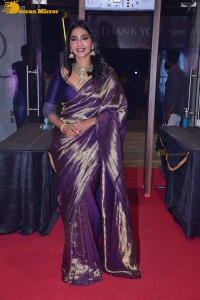 Actress Aishwarya Lekshmi in a purple saree at the pre-release event of Ponniyin Selvan
