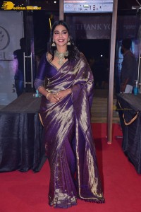 Actress Aishwarya Lekshmi in a purple saree at the pre-release event of Ponniyin Selvan