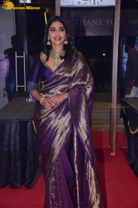 Actress Aishwarya Lekshmi in a purple saree at the pre-release event of Ponniyin Selvan