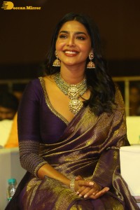 Actress Aishwarya Lekshmi in a purple saree at the pre-release event of Ponniyin Selvan