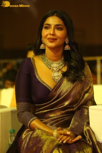 Actress Aishwarya Lekshmi in a purple saree at the pre-release event of Ponniyin Selvan