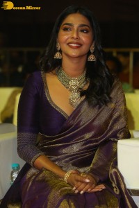 Actress Aishwarya Lekshmi in a purple saree at the pre-release event of Ponniyin Selvan