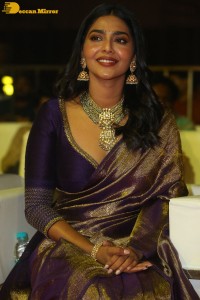 Actress Aishwarya Lekshmi in a purple saree at the pre-release event of Ponniyin Selvan