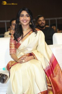 Actress Aishwarya Lekshmi in a cream color saree attending a movie function