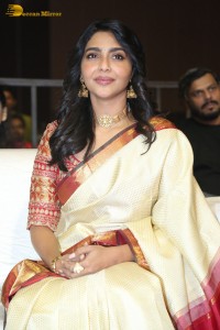 Actress Aishwarya Lekshmi in a cream color saree attending a movie function