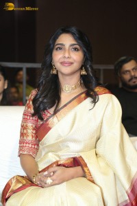 Actress Aishwarya Lekshmi in a cream color saree attending a movie function